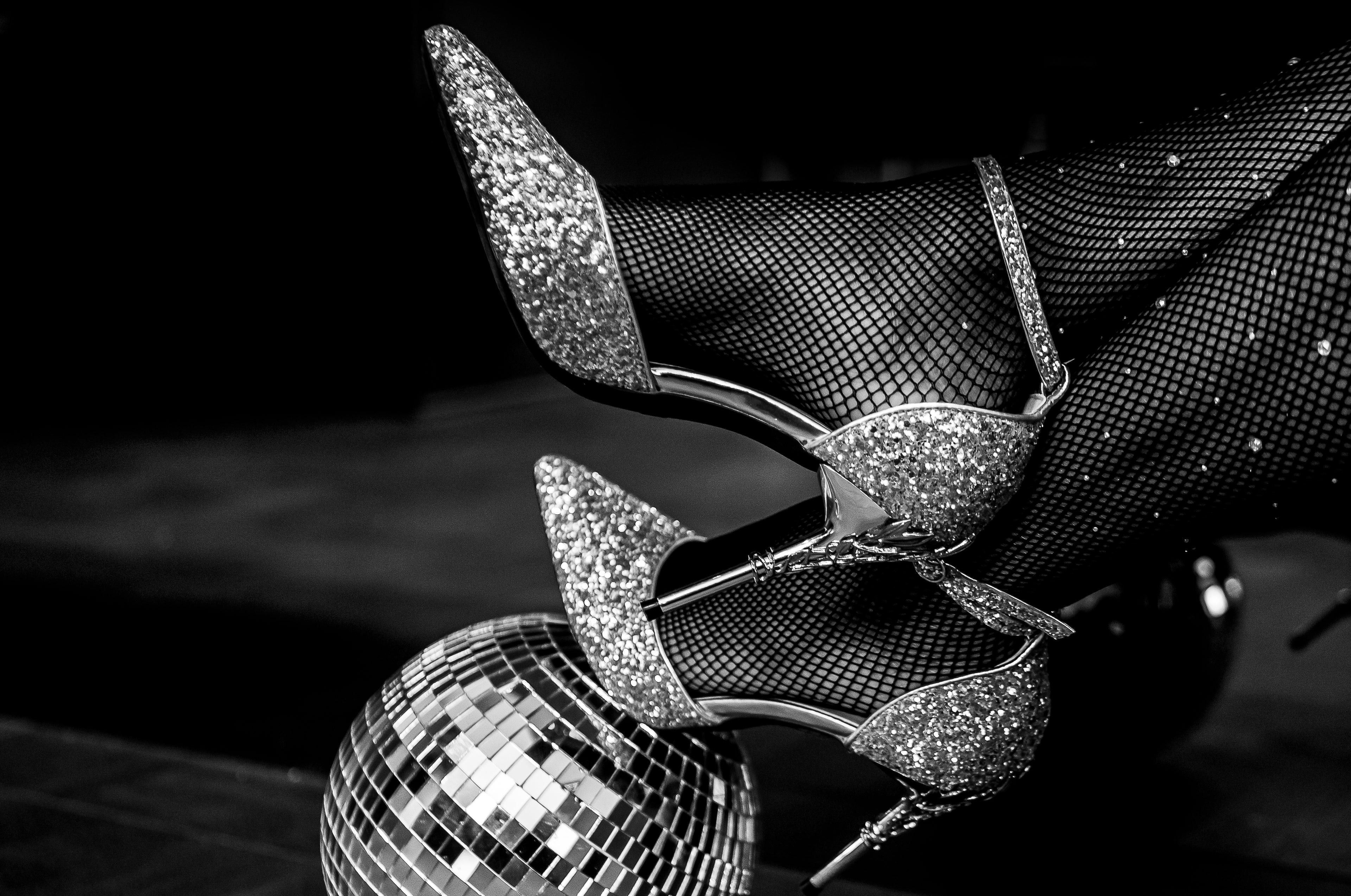 Load video: Glittery heels balancing on disco ball
